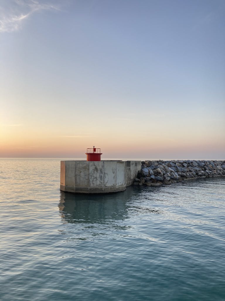 Jetty With a Beacon at Dusk